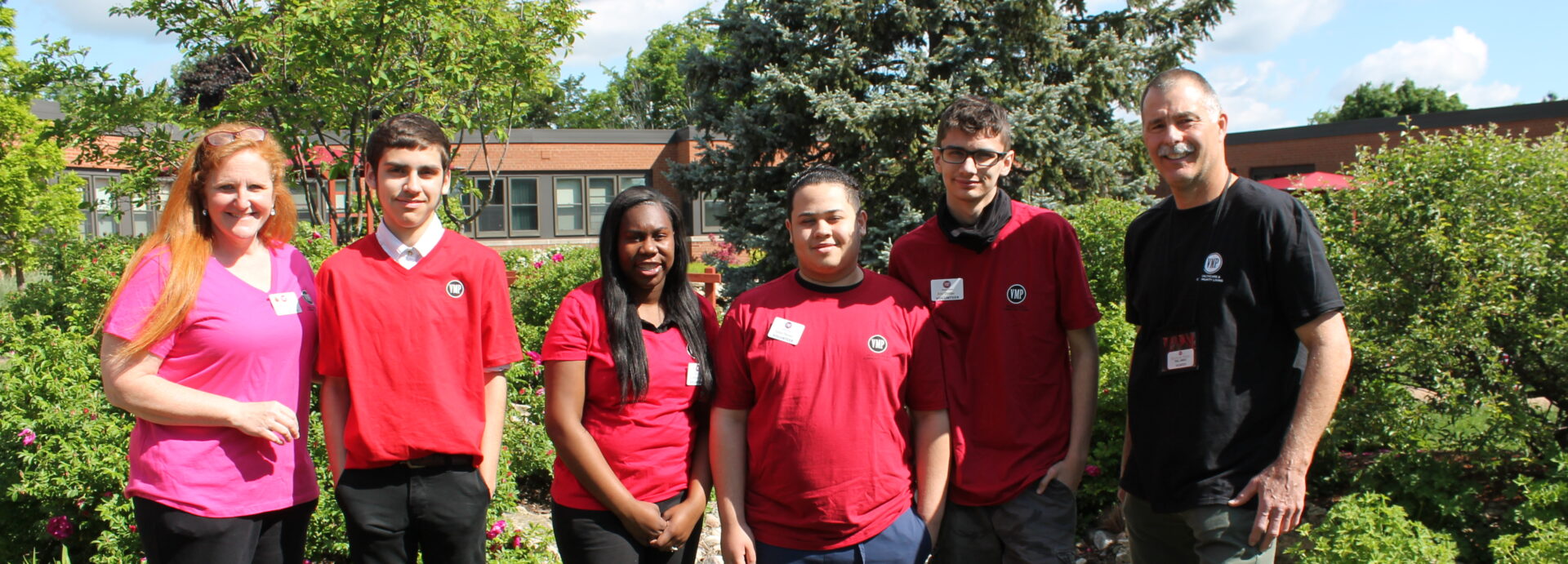 Volunteers smiling together outside VMP Milwaukee.